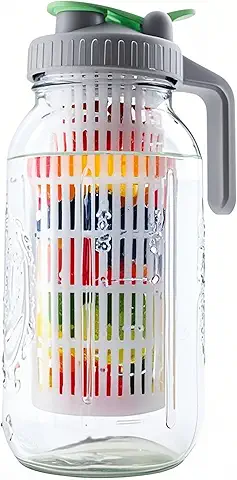 Glass infuser jug with colorful fruits inside for detox water