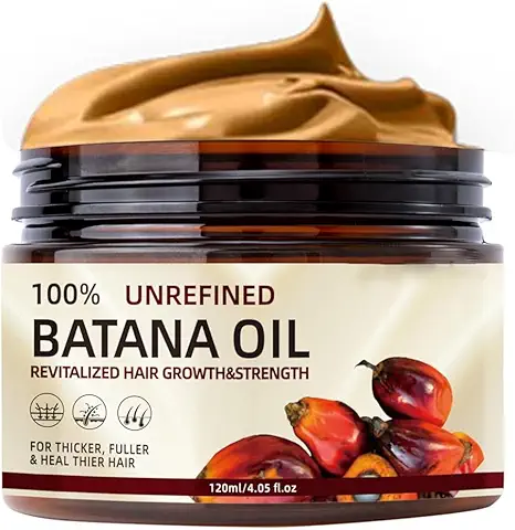 100% unrefined batana oil in a jar with palm fruits for hair growth and strength.